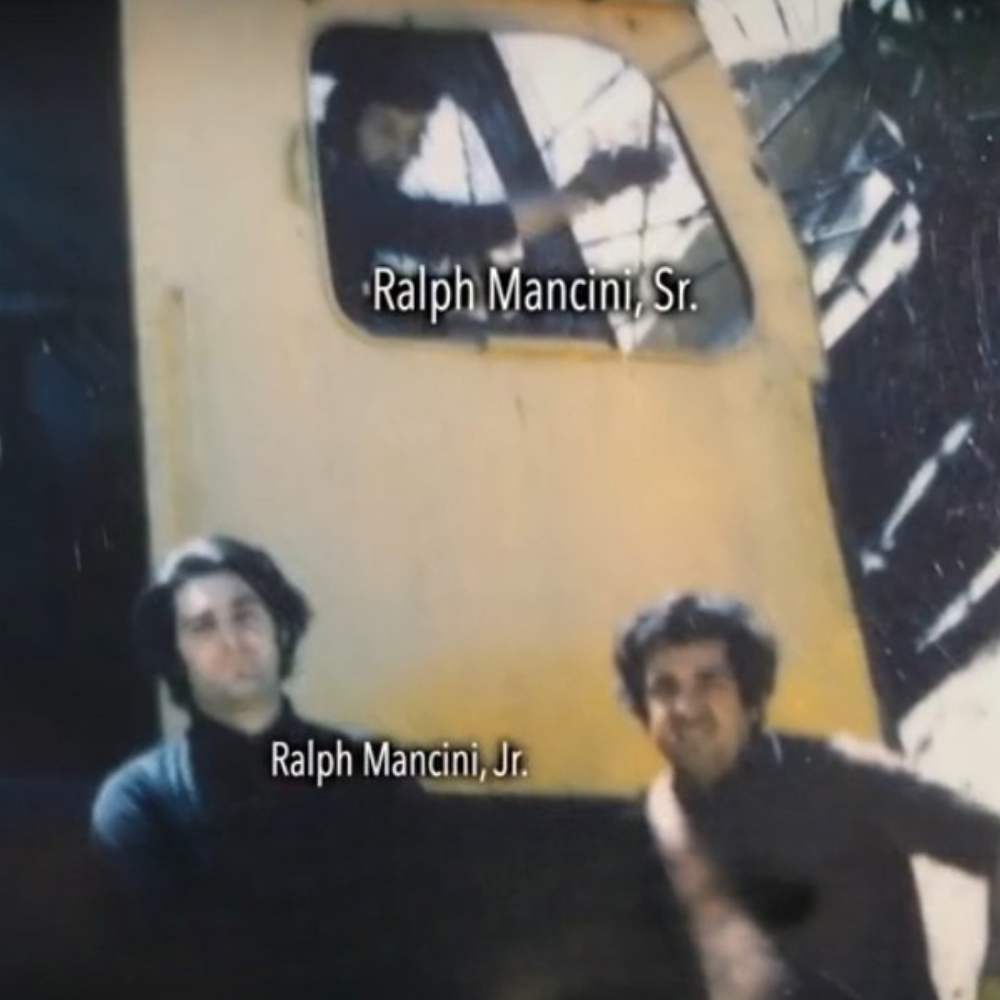 Historic photo of Ralph Mancini Sr. and Ralph Mancini Jr. operating demolition equipment – founders of RI Demo, a third-generation Rhode Island demolition company.