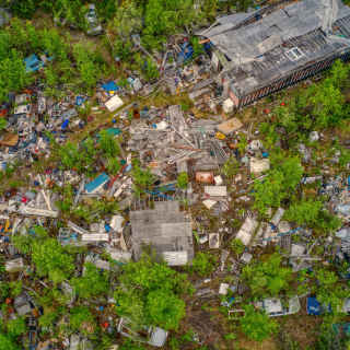 Overgrown and cluttered property prepared for hoarder cleanout and distressed property demolition in Southern Rhode Island
